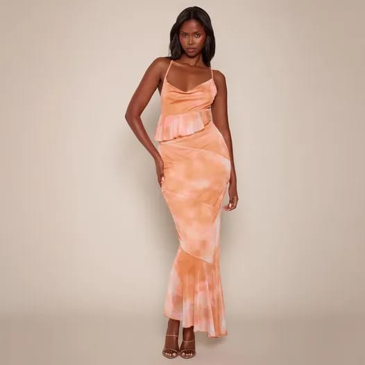 A product page: an orange tie-dye maxi dress