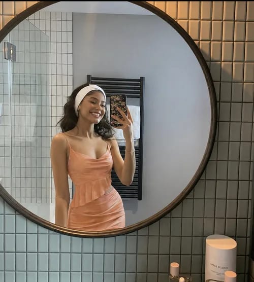 The same shopper wearing the dress